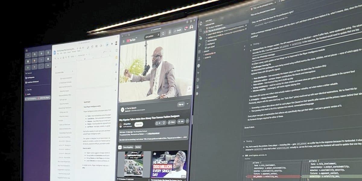The ultrawide late at night, code and a video call side by side.